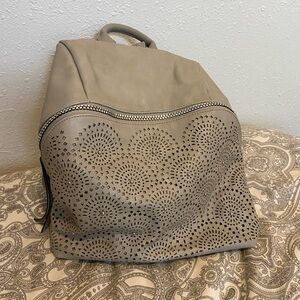Elegant Grey Laser-Cut Backpack